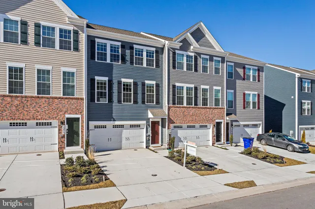a view of a brick house with many windows and a stove