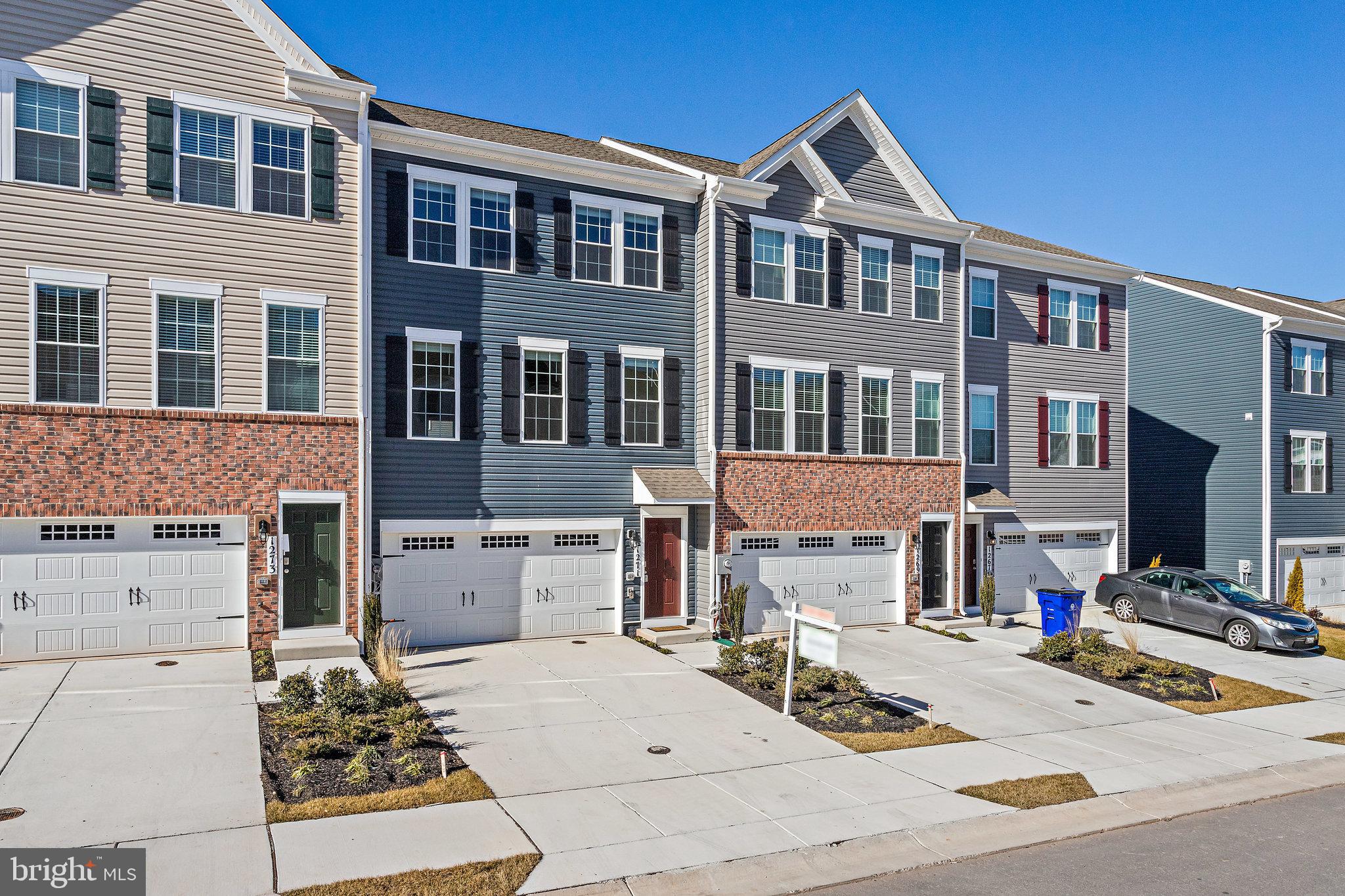 1271 Apollo Drive Frederick, MD 21702 - Photo 4 of 42 a view of a brick house with many windows and a stove