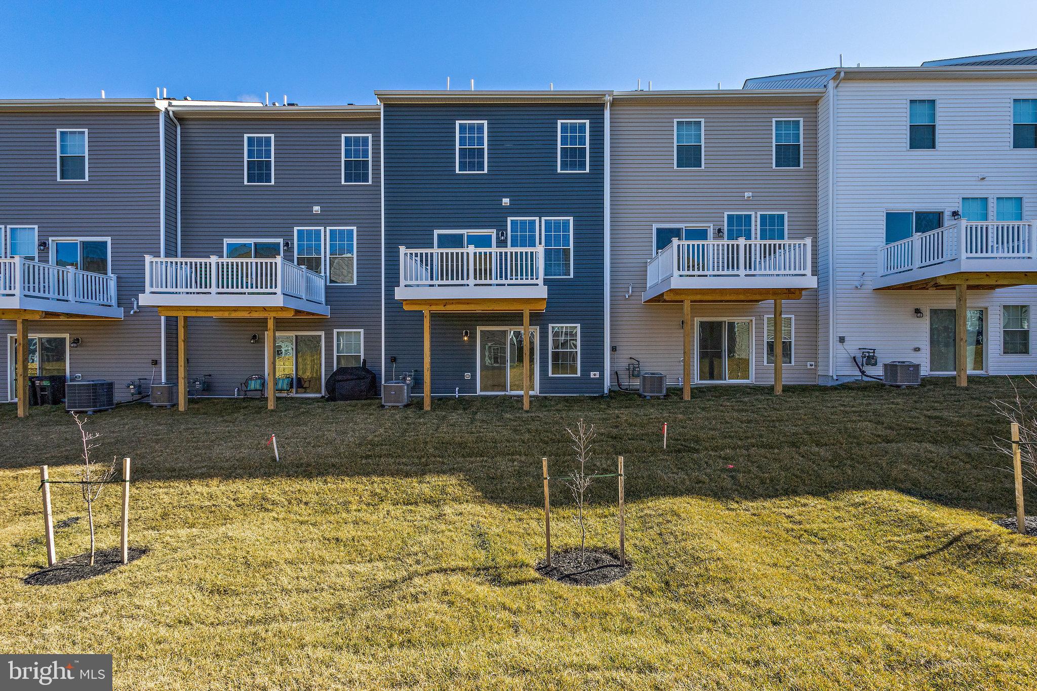 1271 Apollo Drive Frederick, MD 21702 - Photo 41 of 42 a front view of a building with a yard