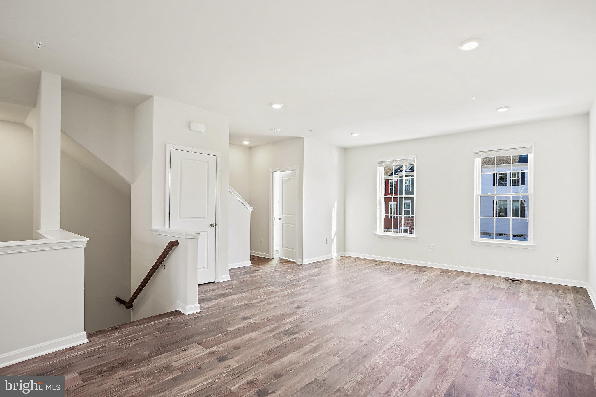 1271 Apollo Drive Frederick, MD 21702 - Photo 5 of 42 a view of an empty room with wooden floor and a window