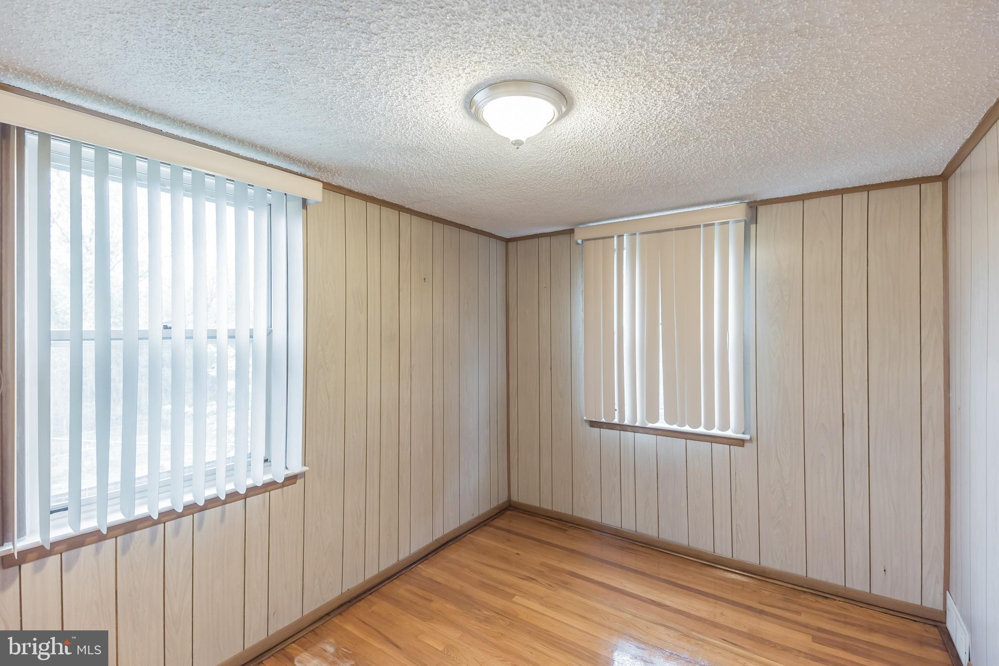 1024 South Lynbrook Road Darby, PA 19023 - Photo 14 of 29 a view of an empty room with wooden floor and a window