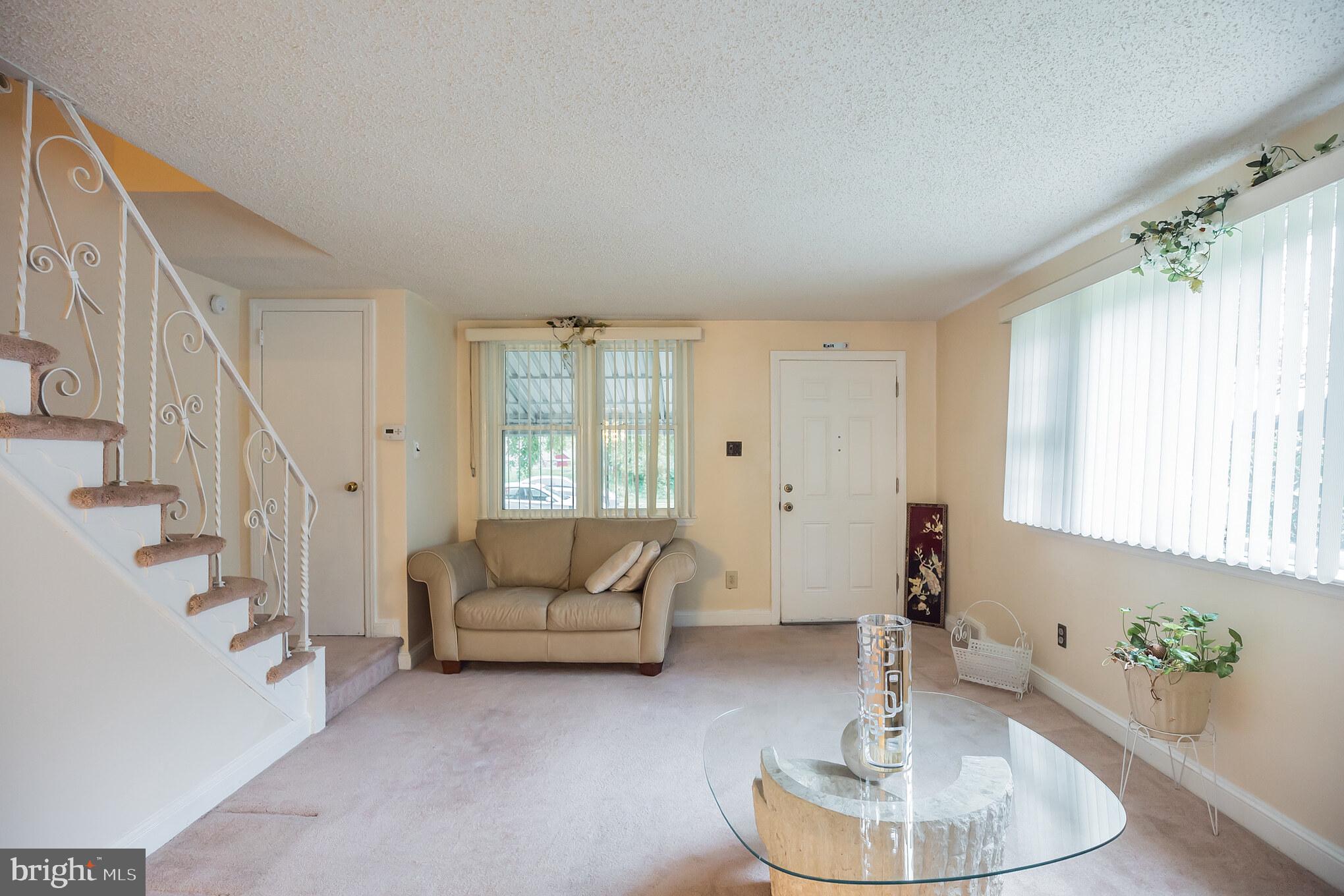 1024 South Lynbrook Road Darby, PA 19023 - Photo 6 of 29 a living room with furniture and a potted plant