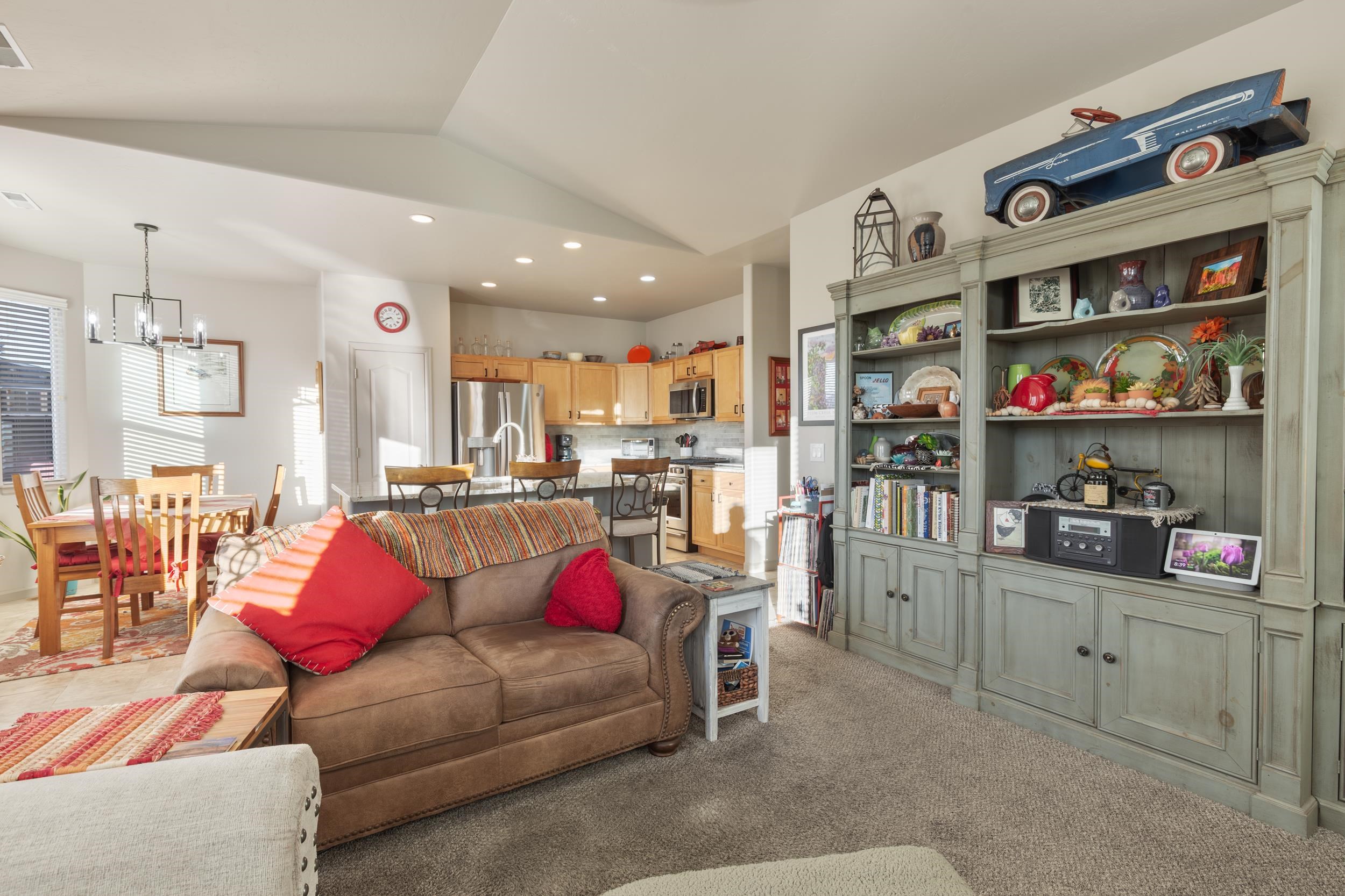 3033 Prairie View Drive Grand Junction, CO 81504 - Photo 12 of 32 a living room with furniture cabinets and kitchen view