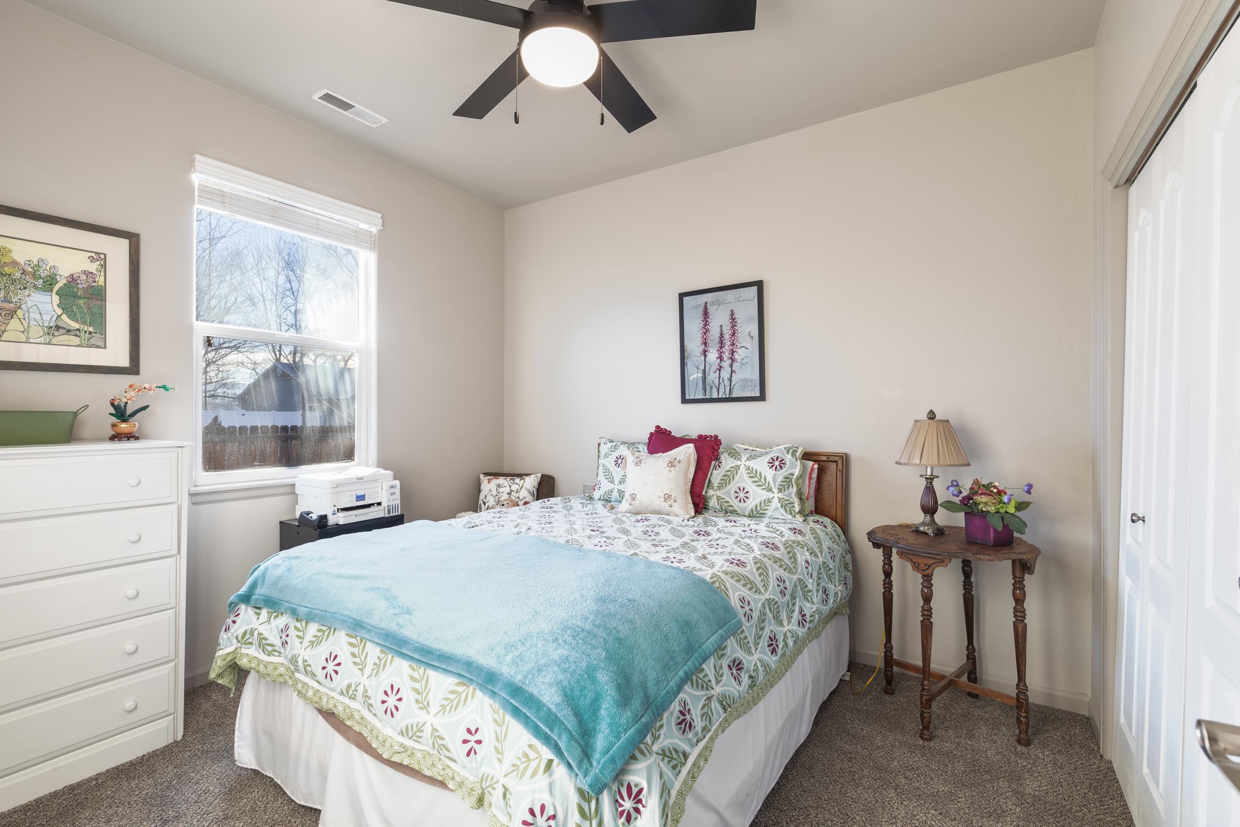 3033 Prairie View Drive Grand Junction, CO 81504 - Photo 15 of 32 a bedroom with double bed and a window