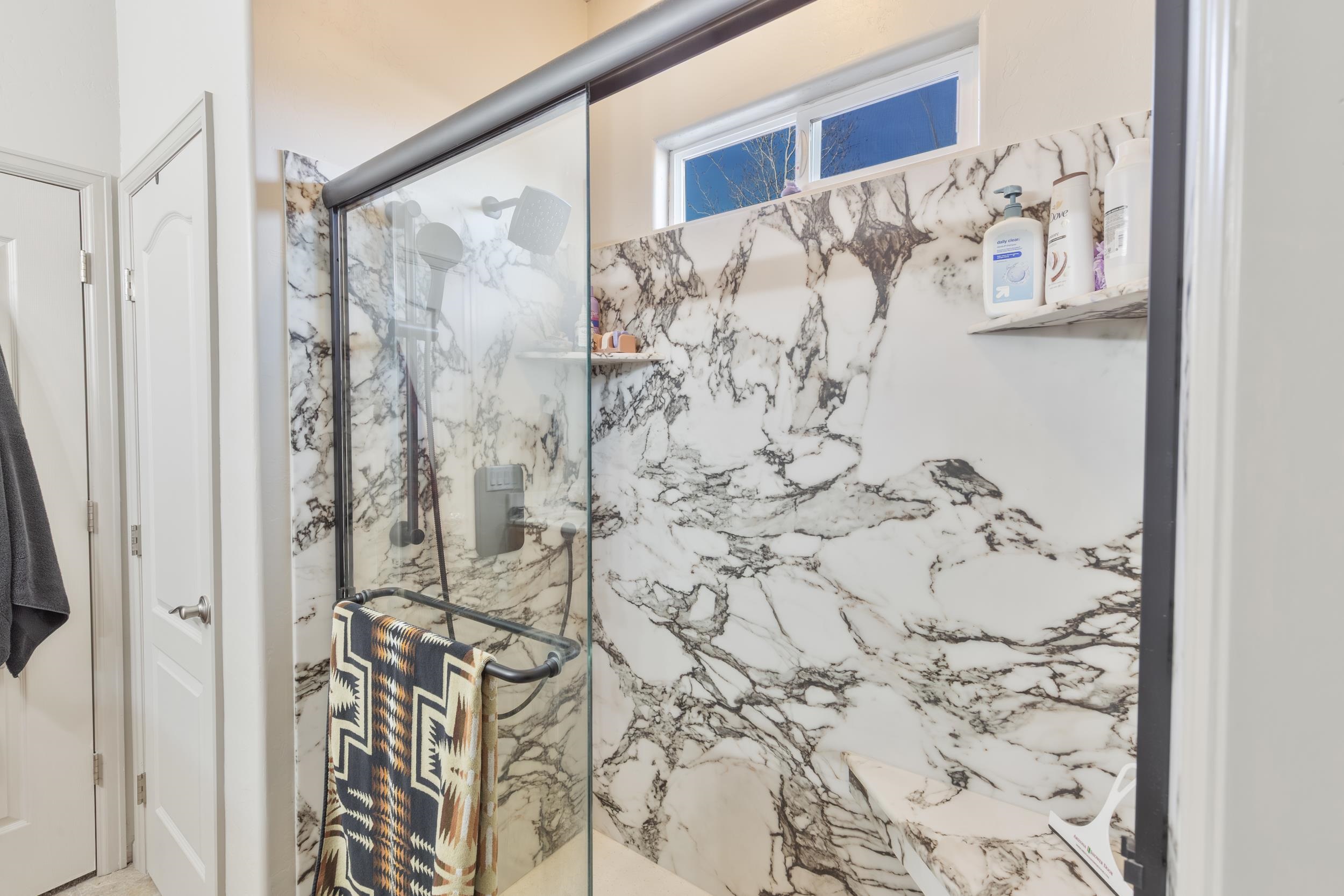 3033 Prairie View Drive Grand Junction, CO 81504 - Photo 22 of 32 a bathroom with a shower curtain