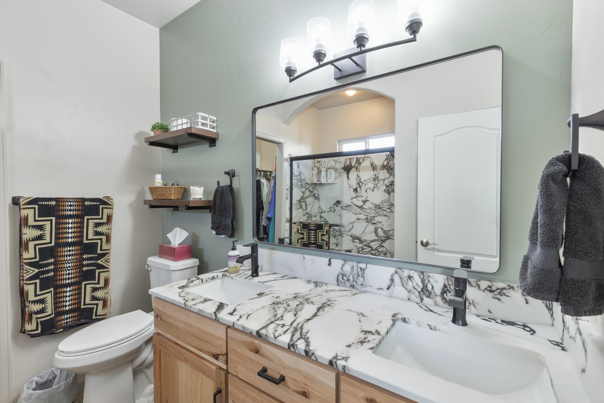 3033 Prairie View Drive Grand Junction, CO 81504 - Photo 23 of 32 a bathroom with a sink vanity mirror and toilet