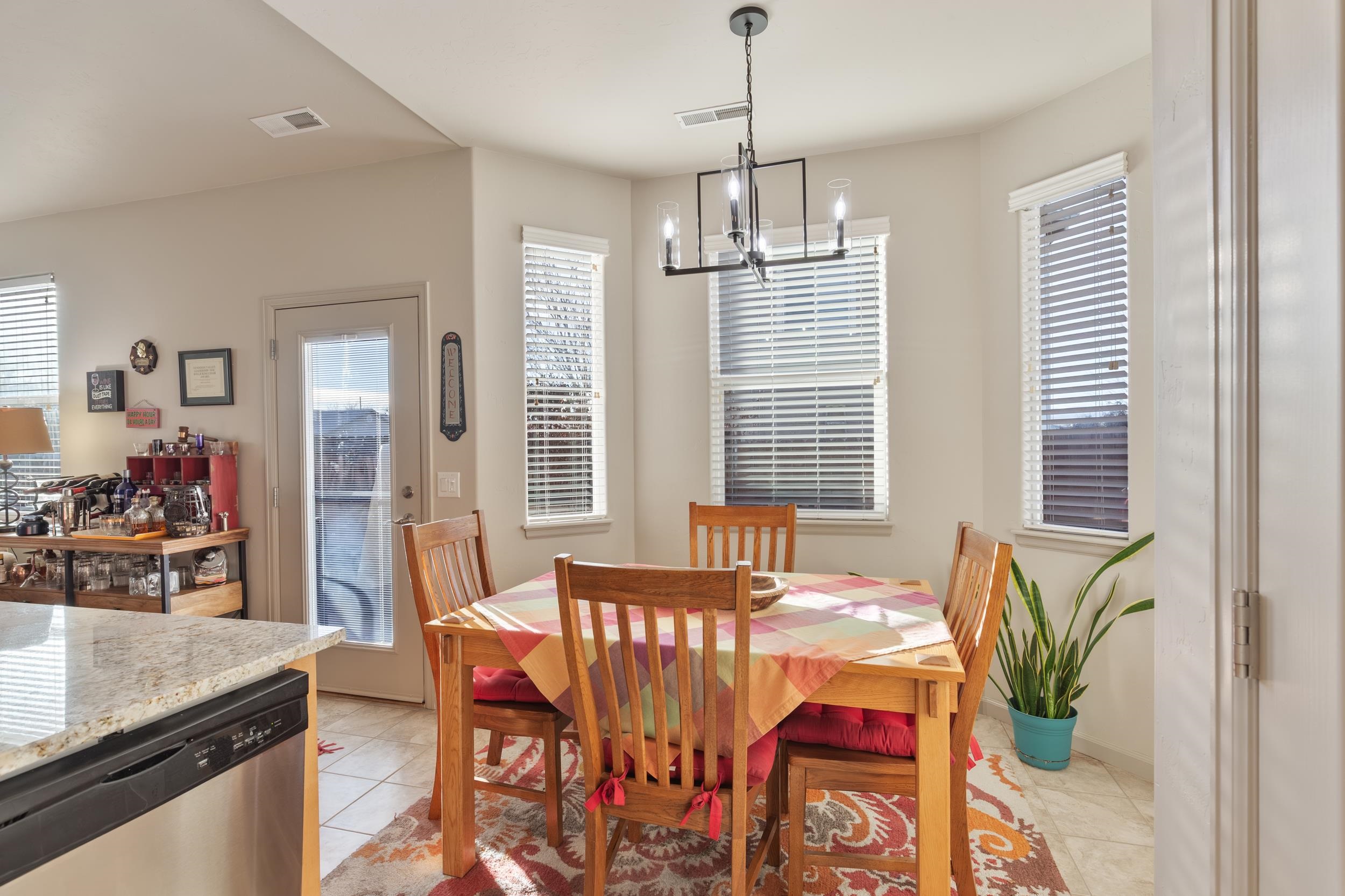3033 Prairie View Drive Grand Junction, CO 81504 - Photo 10 of 32 a view of a dining room with furniture window and outside view