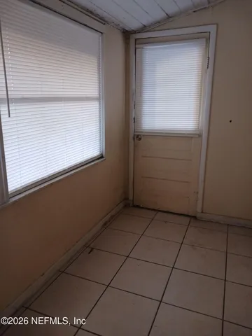 a view of a utility room and window in a room
