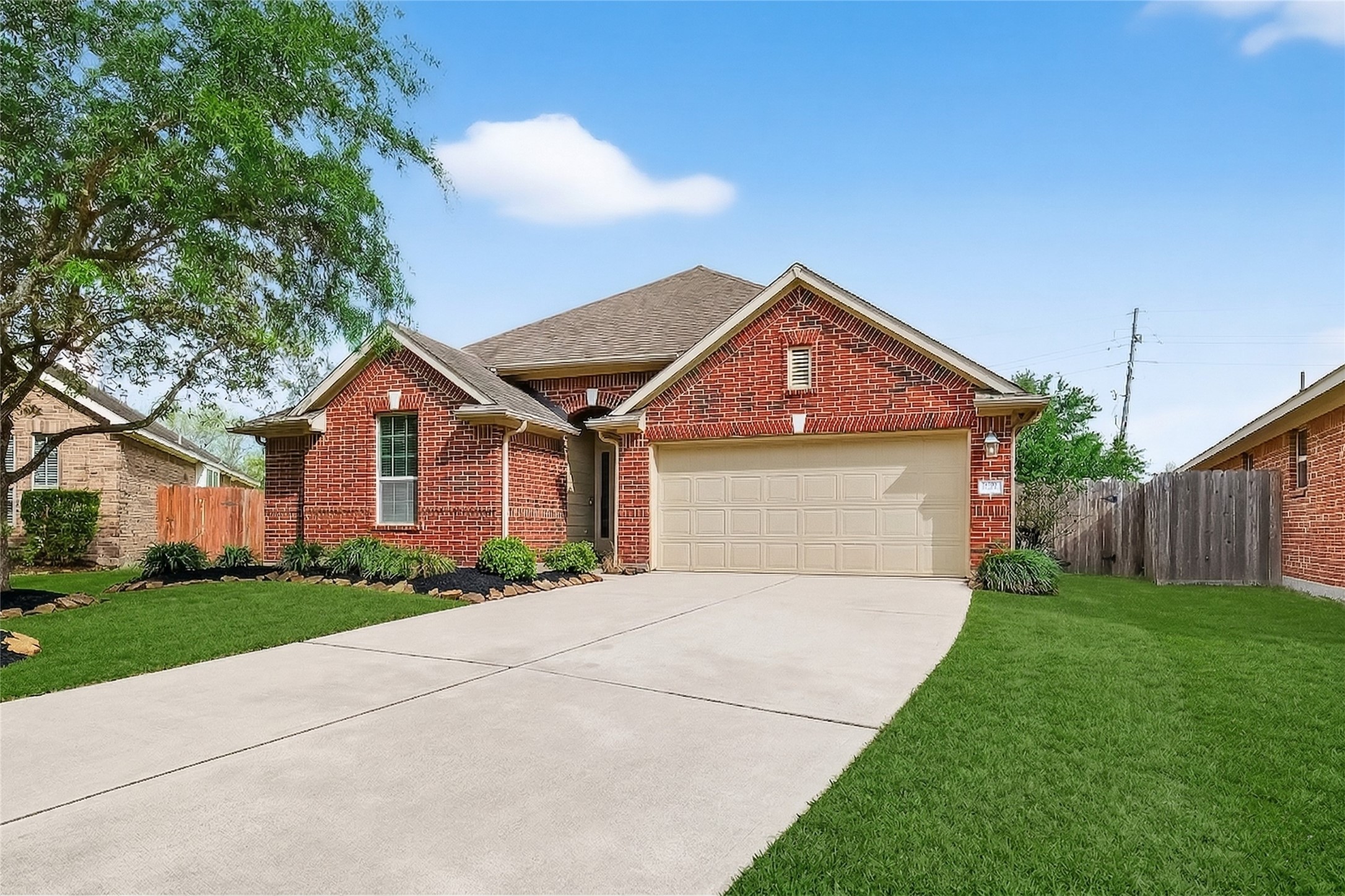 13415 Star Creek Lane Rosharon, TX 77583 - Photo 37 of 46 a front view of a house with a yard and garage