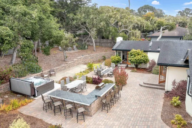 an outdoor space with furniture and garden view