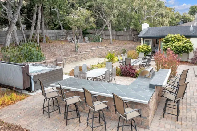 a view of an outdoor space with a table and chairs