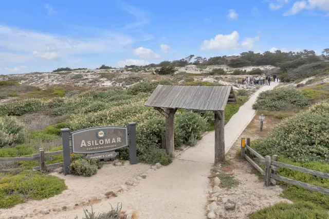 a view of a street with a building in the background