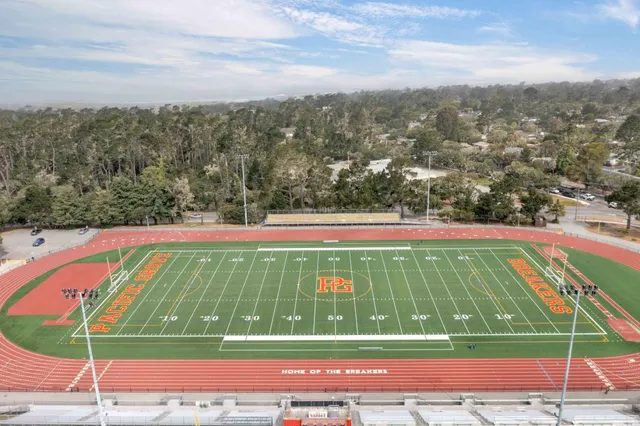 a view of outdoor space with swimming pool and green space