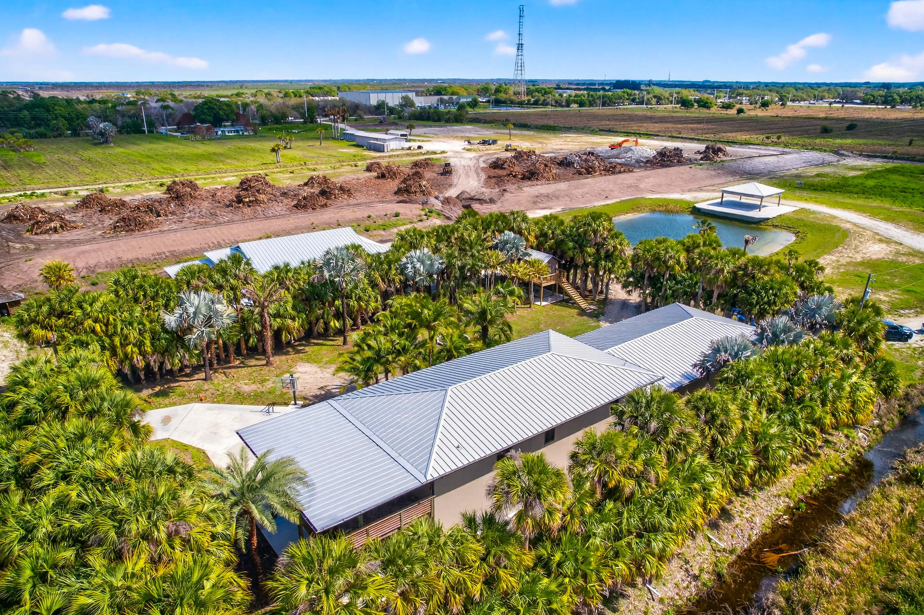 200 South Graves Road Fort Pierce, FL 34945 - Photo 12 of 58 an aerial view of a residential houses with outdoor space and swimming pool