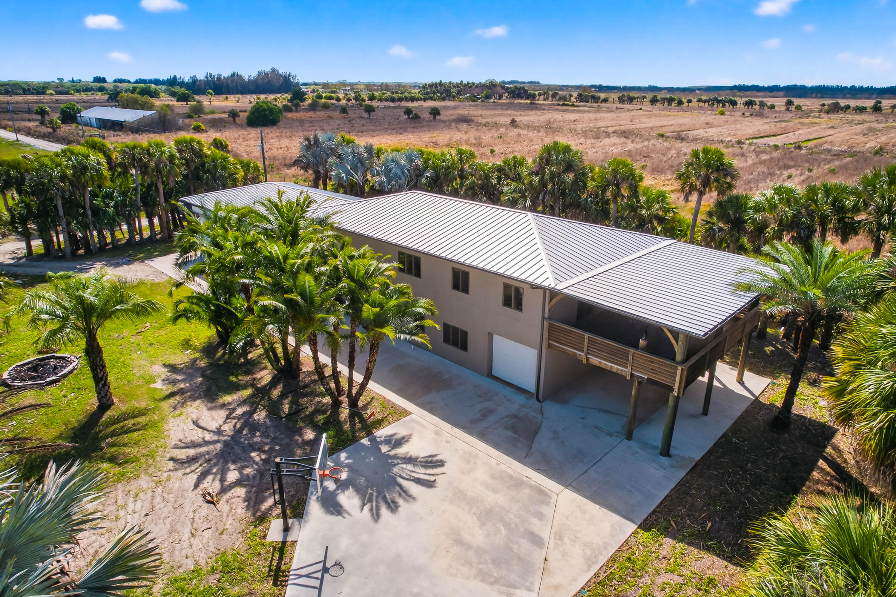 200 South Graves Road Fort Pierce, FL 34945 - Photo 2 of 58 a view of a terrace with sitting area