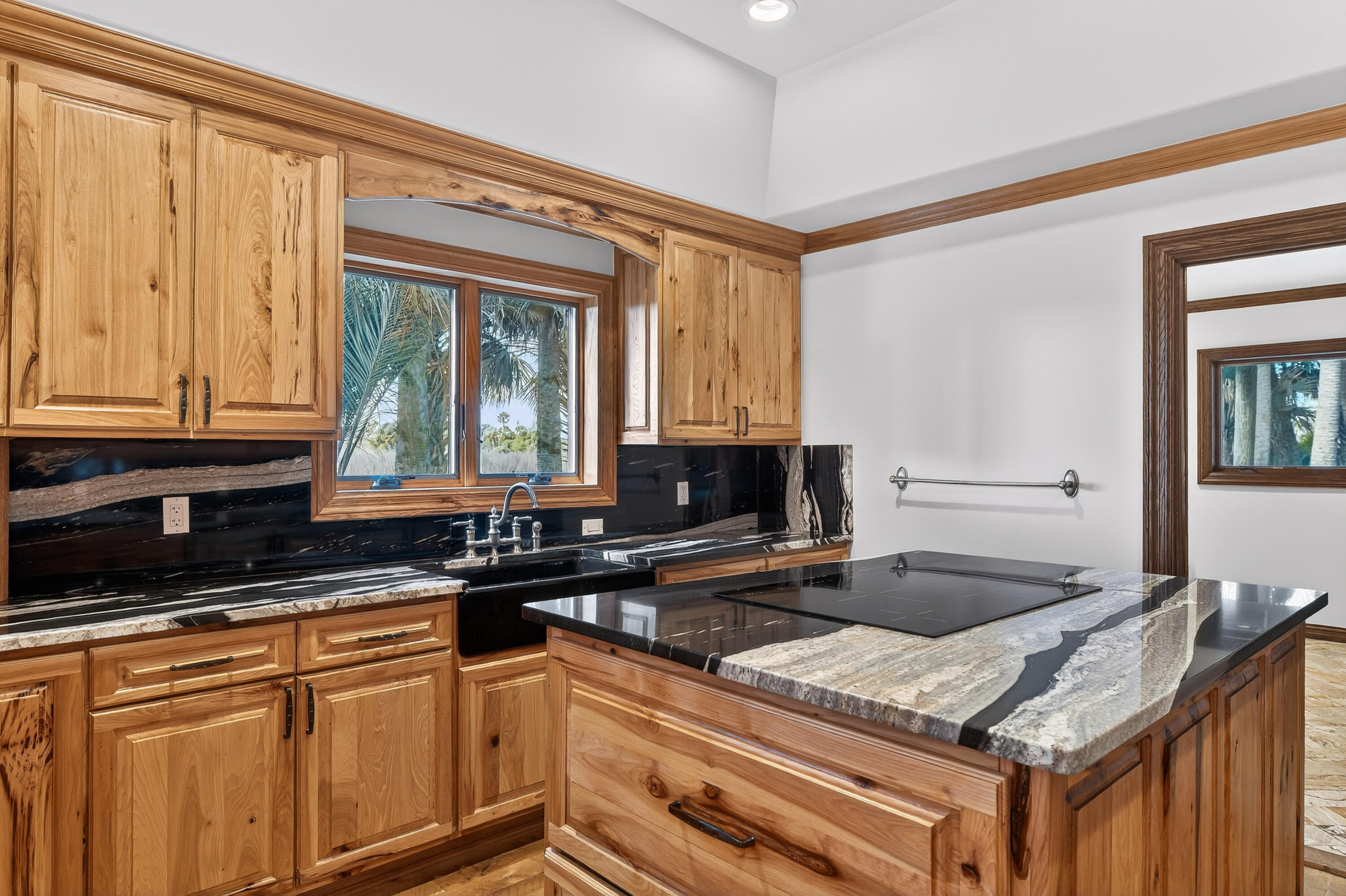 200 South Graves Road Fort Pierce, FL 34945 - Photo 22 of 58 a kitchen with stainless steel appliances granite countertop a stove a sink and a microwave