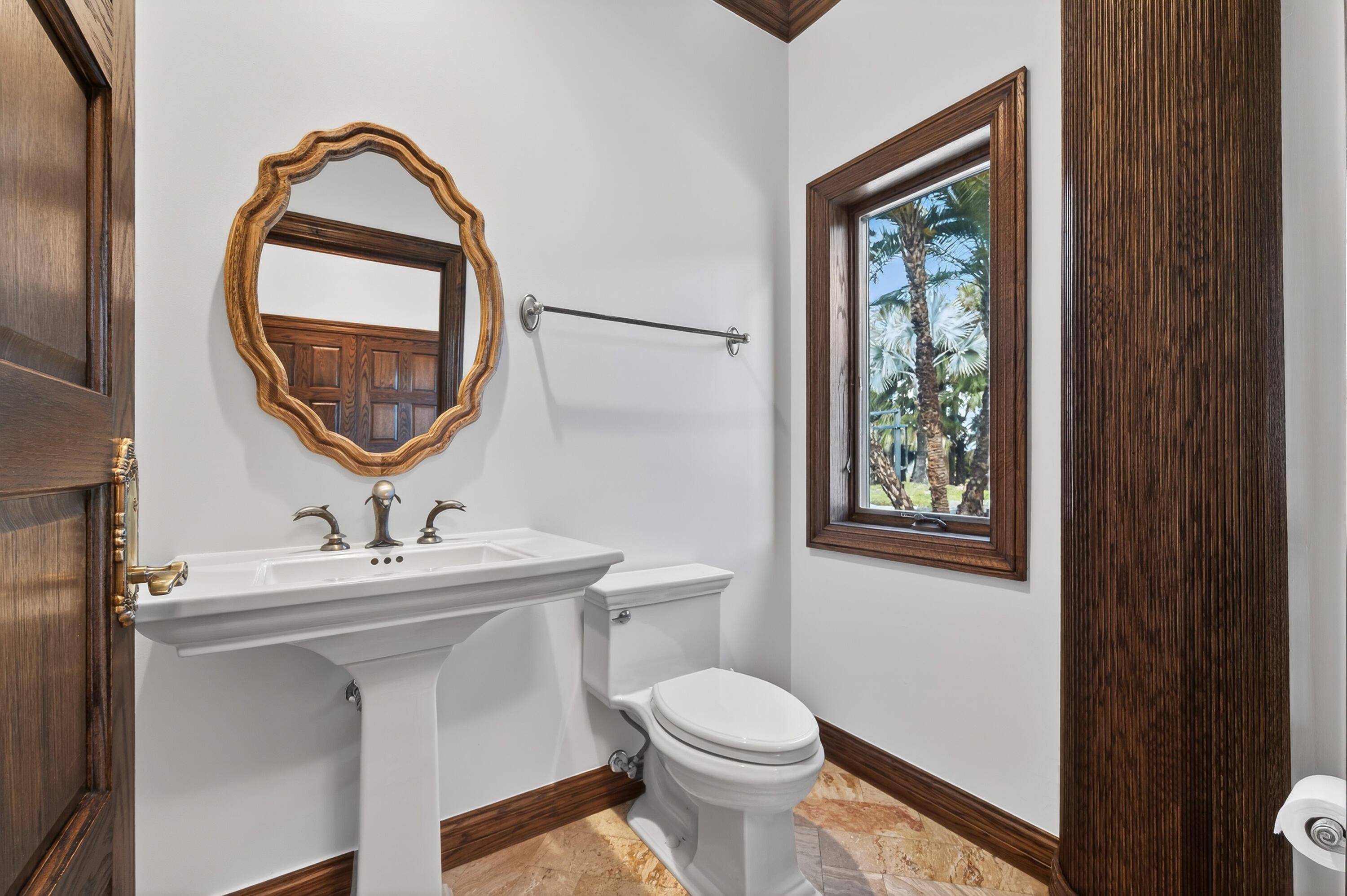 200 South Graves Road Fort Pierce, FL 34945 - Photo 28 of 58 a bathroom with a sink a mirror and a toilet