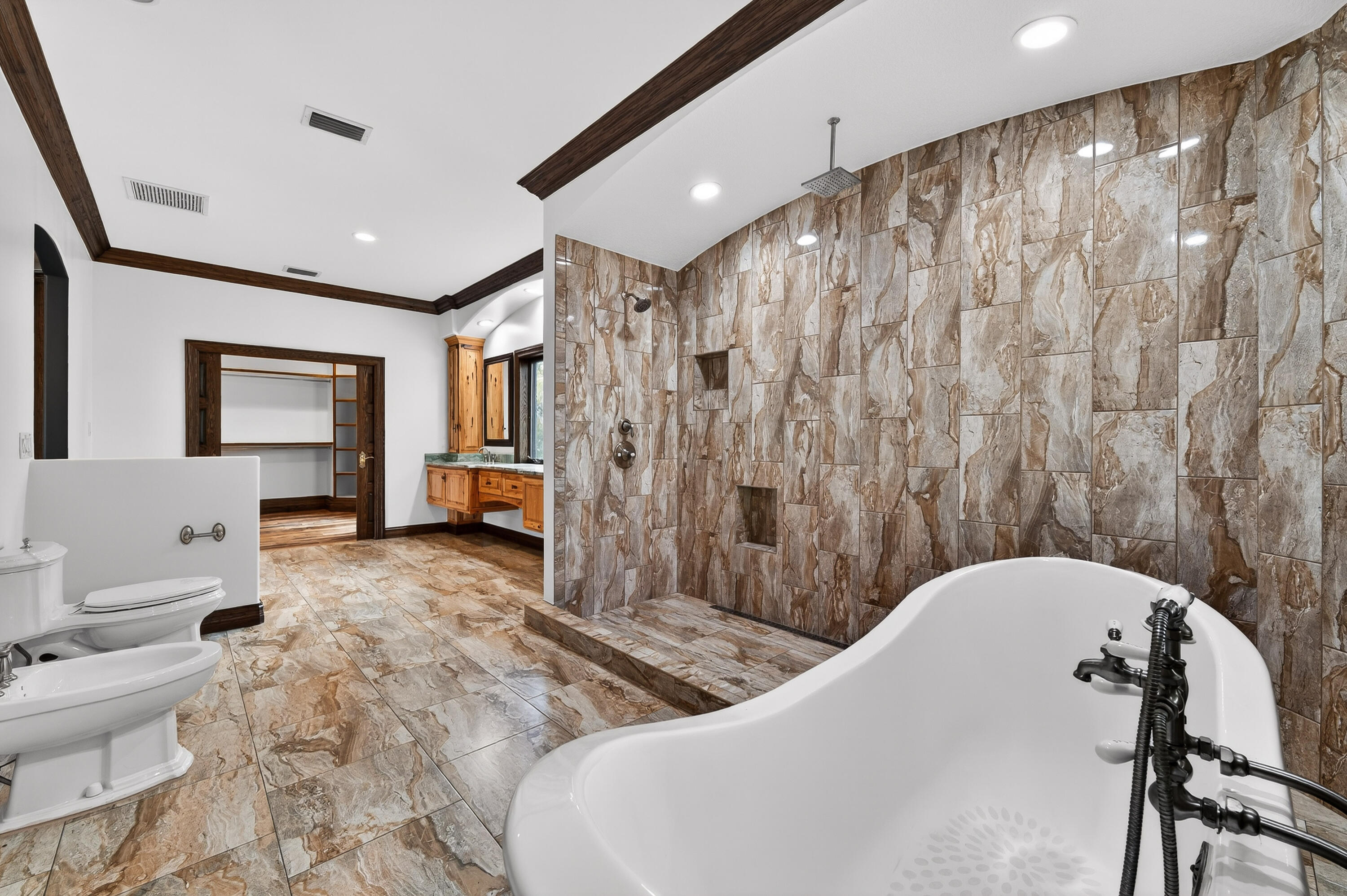 200 South Graves Road Fort Pierce, FL 34945 - Photo 34 of 58 a spacious bathroom with a granite countertop sink a toilet and shower