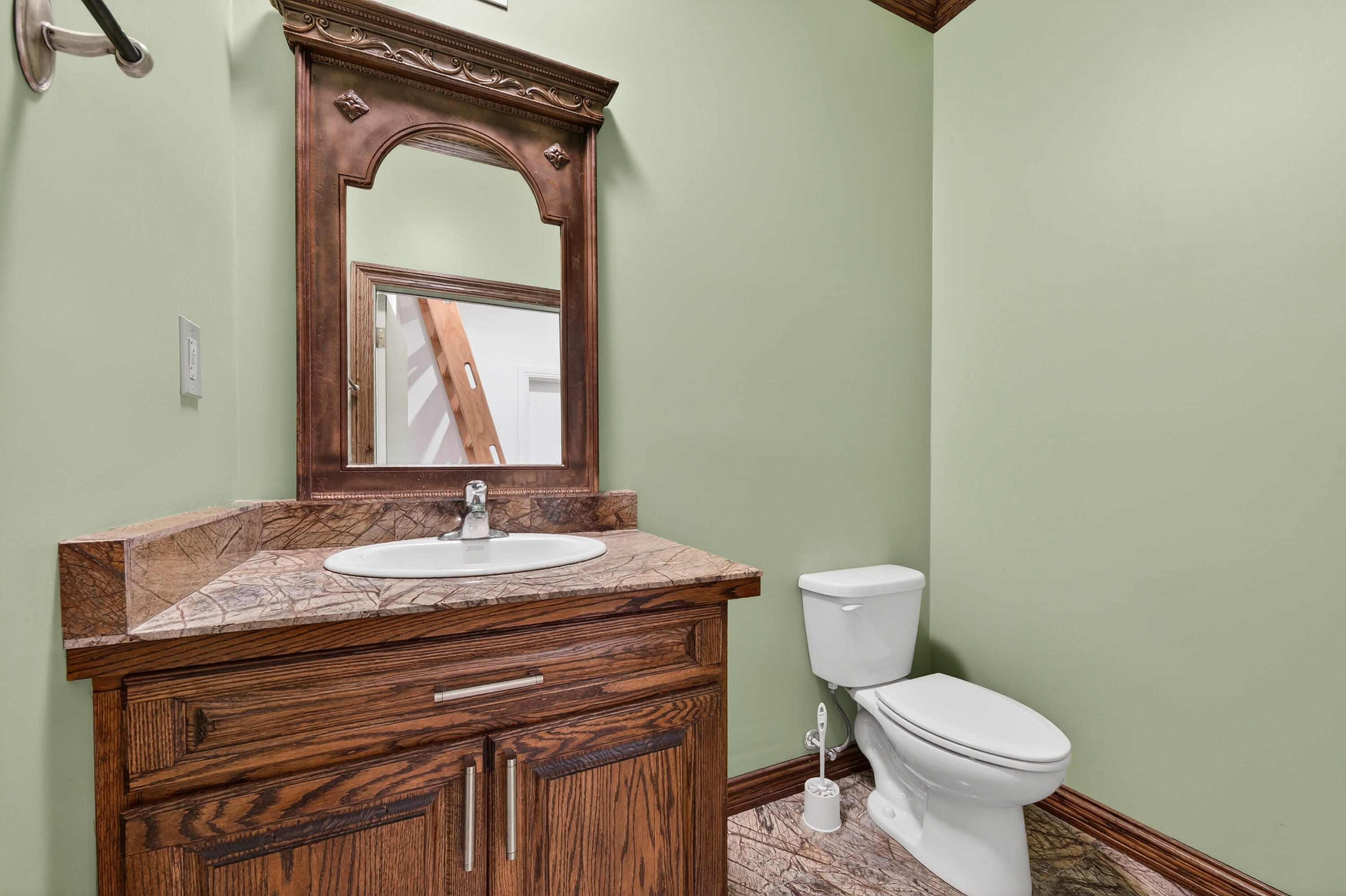 200 South Graves Road Fort Pierce, FL 34945 - Photo 45 of 58 a bathroom with a granite countertop toilet sink and mirror