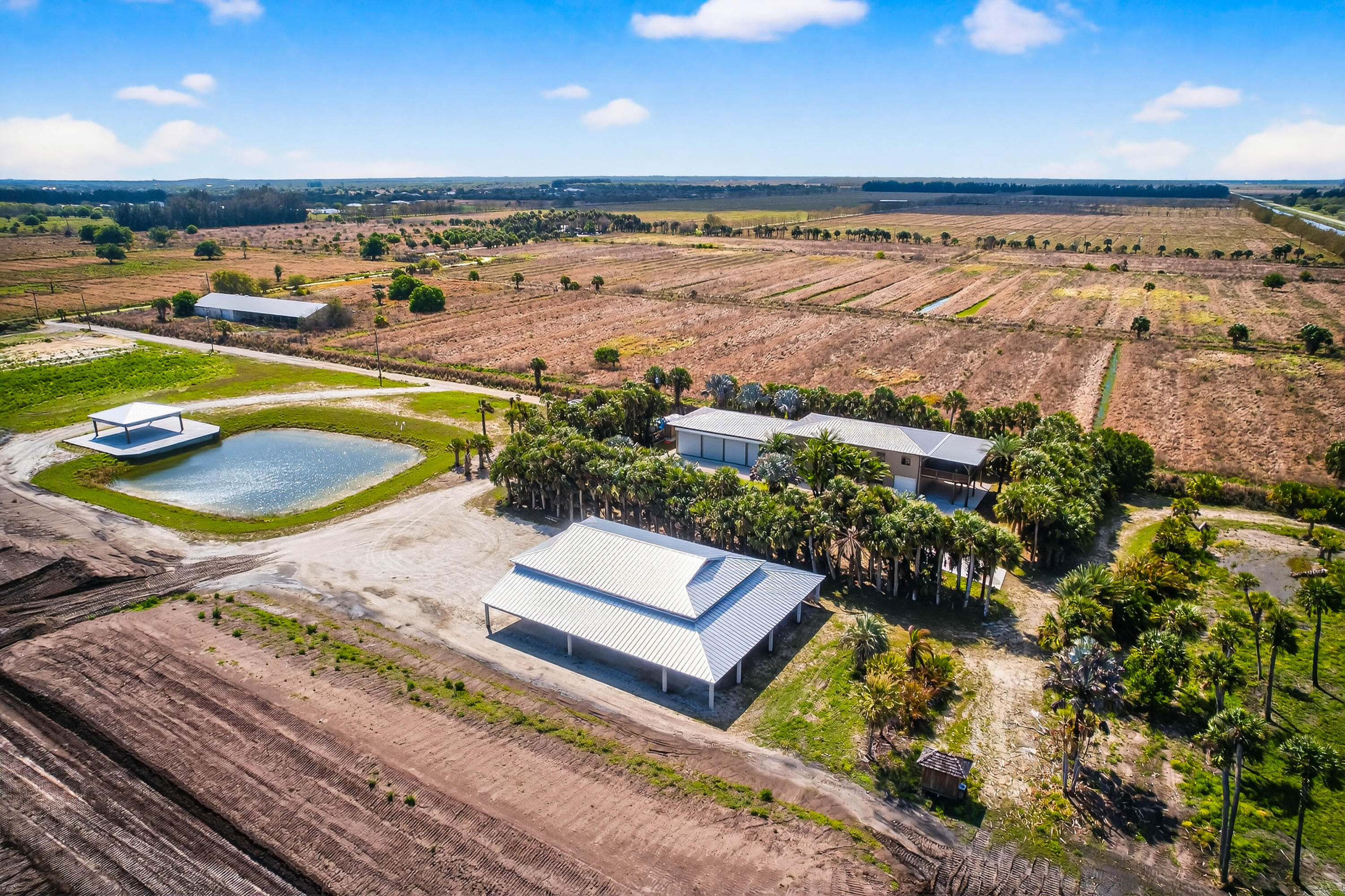 200 South Graves Road Fort Pierce, FL 34945 - Photo 7 of 58 a view of a swimming pool with a table and chairs in a patio
