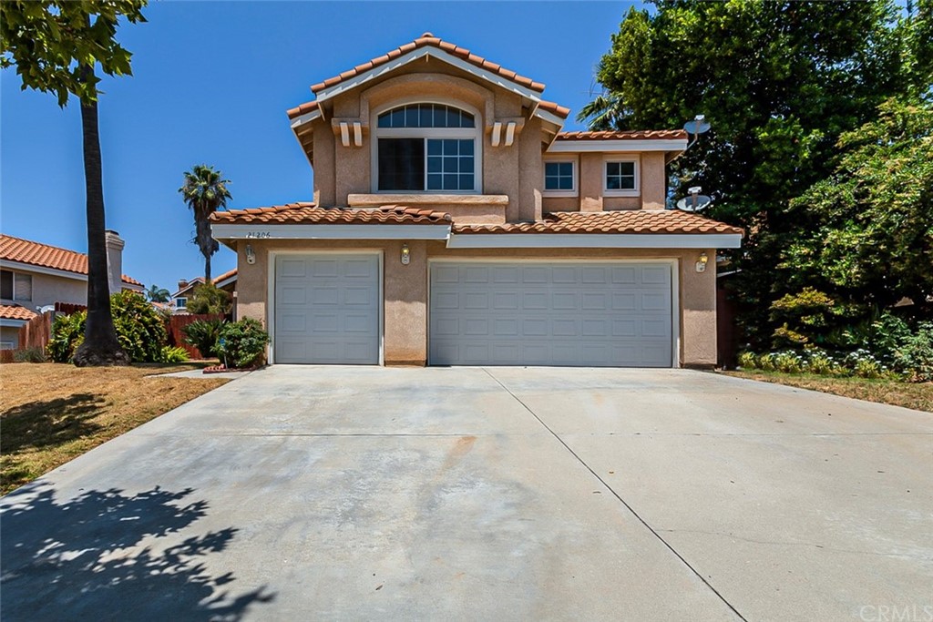 21206 Tennyson Road Moreno Valley, CA 92557 - Photo 1 of 1 a front view of a house with a yard