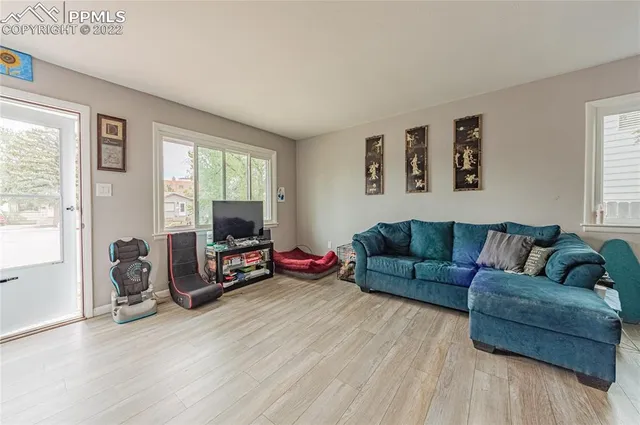a living room with furniture and a window