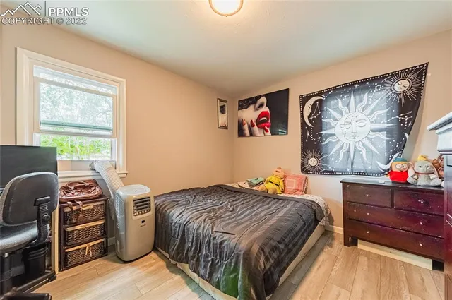 a bedroom with a bed and dresser