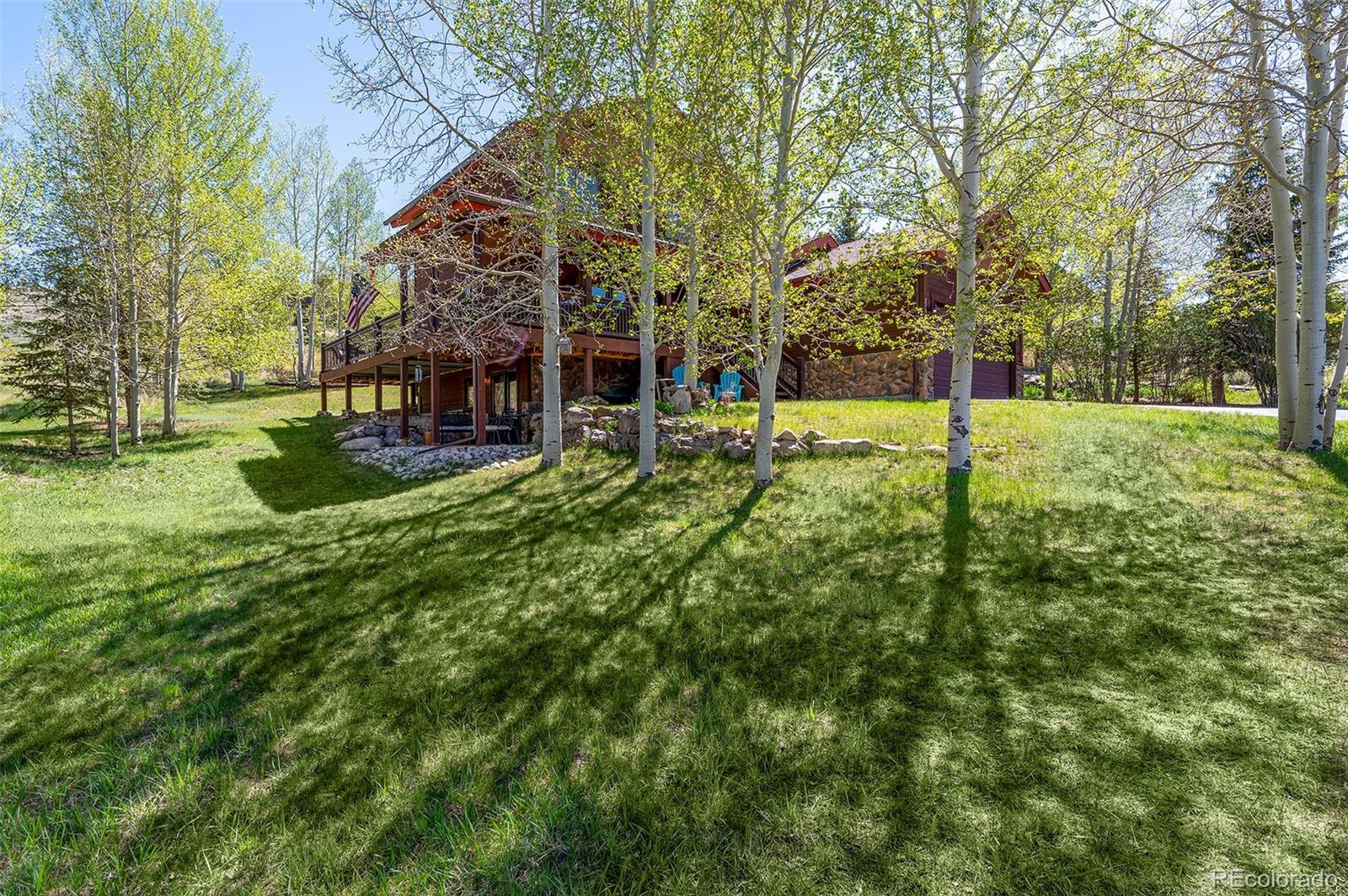 290 Village Road Granby, CO 80446 - Photo 3 of 45 a view of a backyard with large trees
