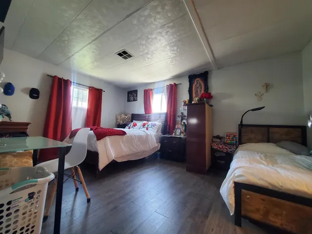 a bed room with a bed and a lamp