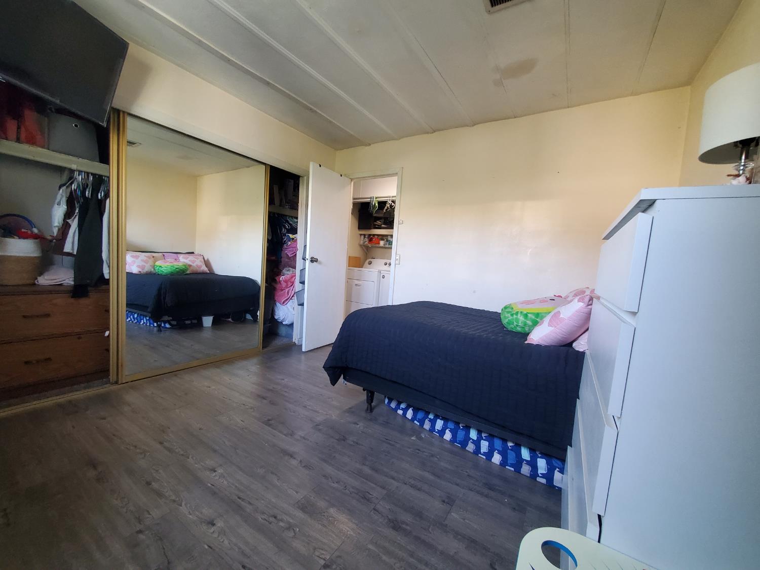 15820 South Harlan Road, Unit 98 Lathrop, CA 95330 - Photo 12 of 25 a bedroom with furniture and a window