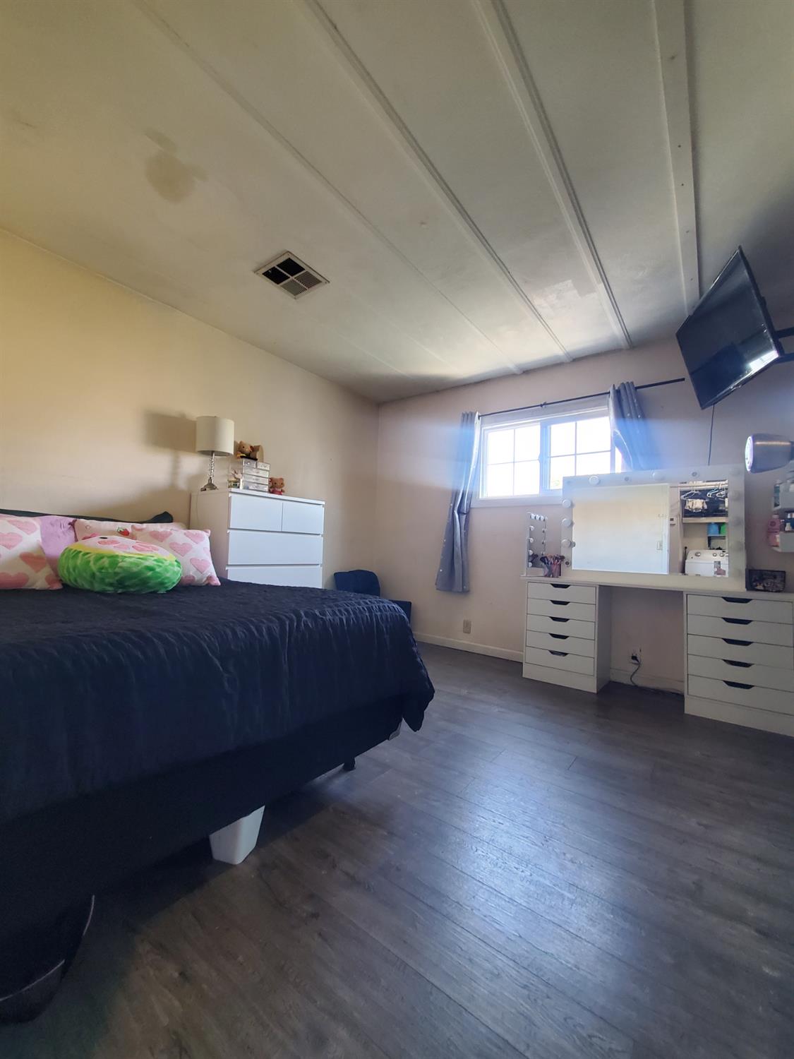 15820 South Harlan Road, Unit 98 Lathrop, CA 95330 - Photo 13 of 25 a bedroom with furniture and window