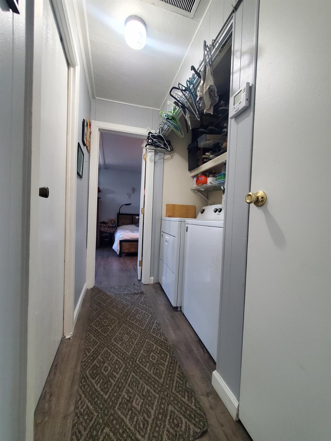 15820 South Harlan Road, Unit 98 Lathrop, CA 95330 - Photo 14 of 25 a view of a hallway with walk in closet