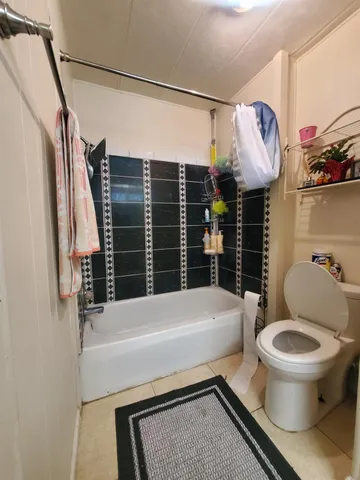 a bathroom with a toilet and a sink