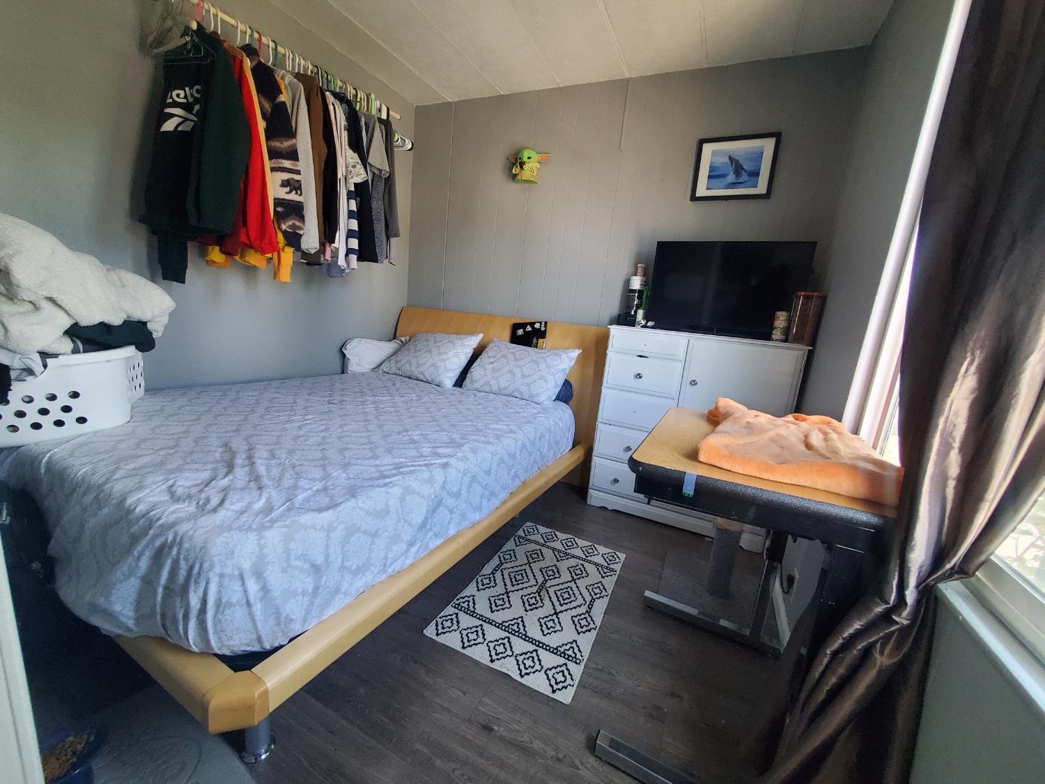 15820 South Harlan Road, Unit 98 Lathrop, CA 95330 - Photo 22 of 25 a bedroom with a bed and a couch