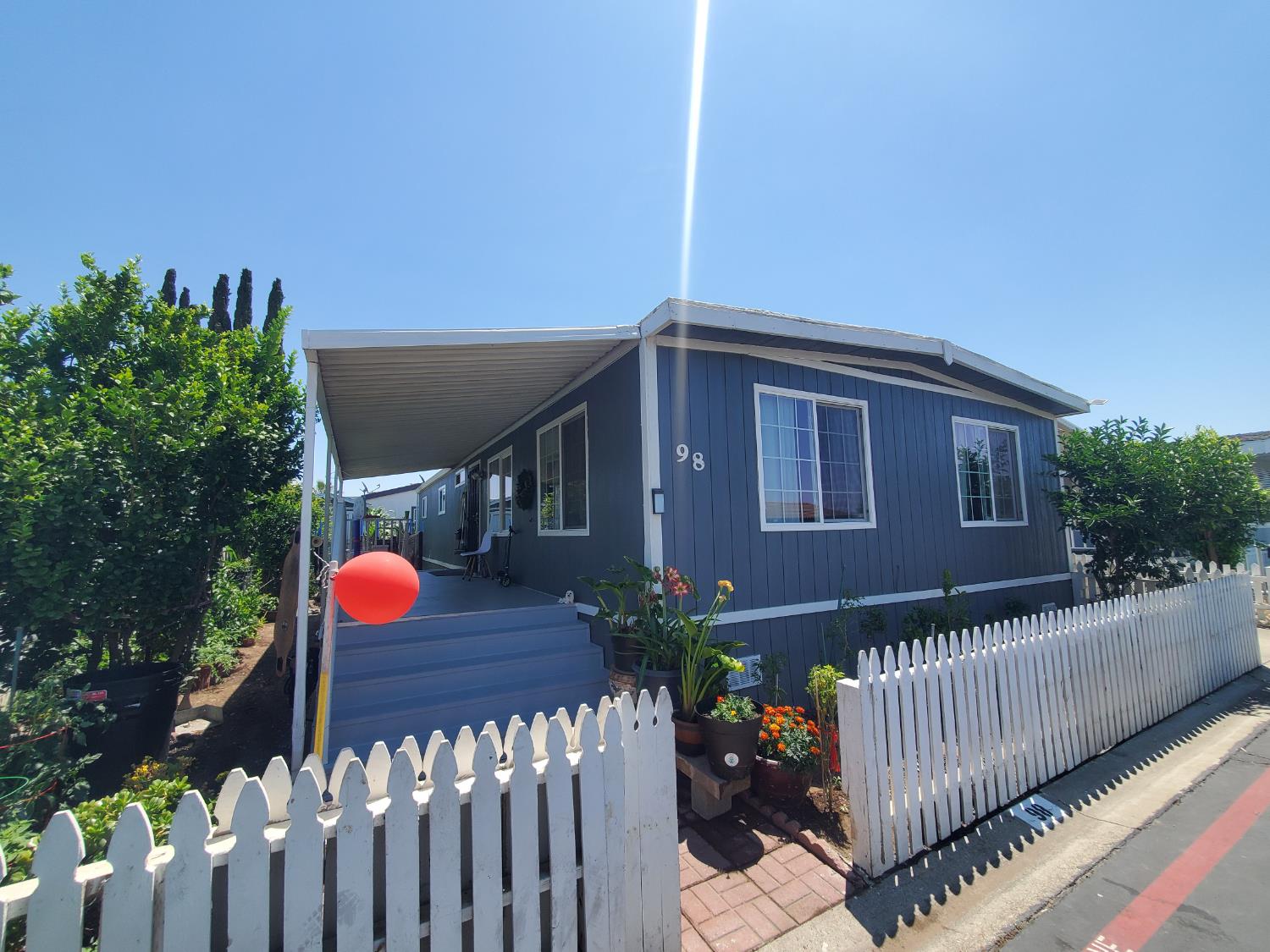 15820 South Harlan Road, Unit 98 Lathrop, CA 95330 - Photo 3 of 25 a view of a backyard with a deck