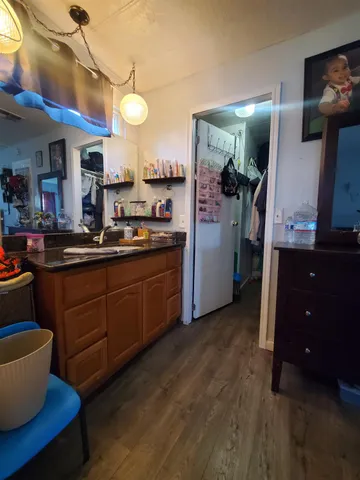 a kitchen with a sink and cabinets