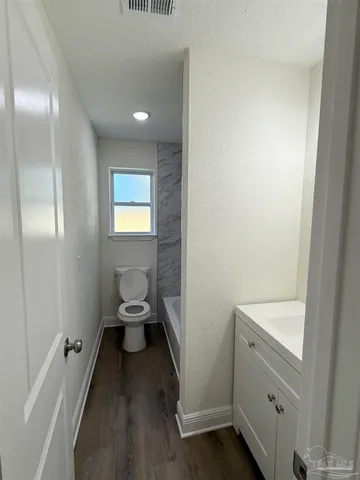 a bathroom with a sink and a toilet
