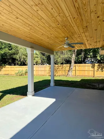 a view of a big room with wooden floor and outdoor space