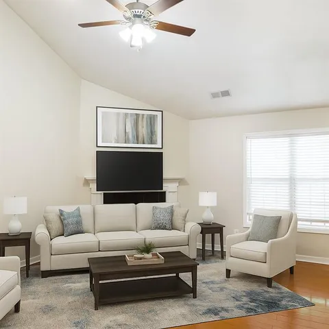 a living room with furniture and a window
