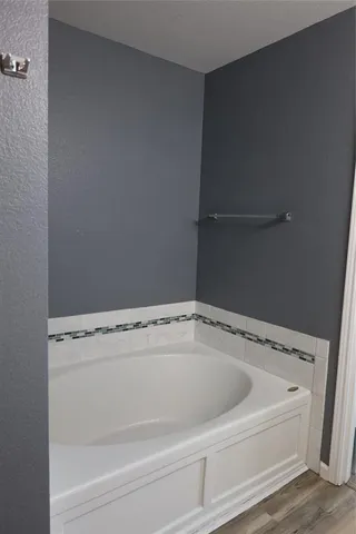 a view of a bath tub sitting in a bathroom