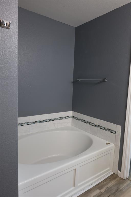 1714 Elm Street Anna, TX 75409 - Photo 14 of 27 a view of a bath tub sitting in a bathroom