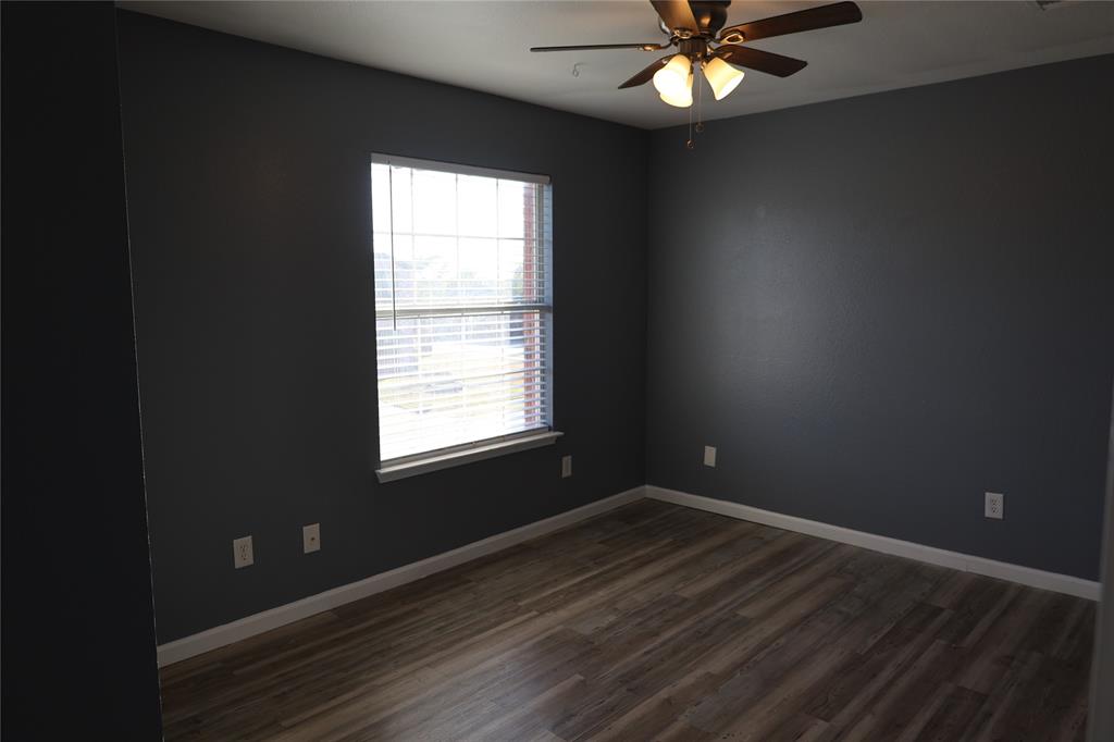 1714 Elm Street Anna, TX 75409 - Photo 17 of 27 a view of an empty room with window and wooden floor