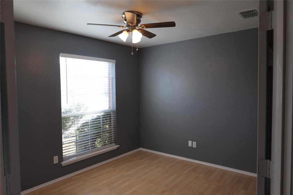 1714 Elm Street Anna, TX 75409 - Photo 19 of 27 an empty room with windows and fan