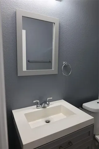 a bathroom with a sink and a toilet