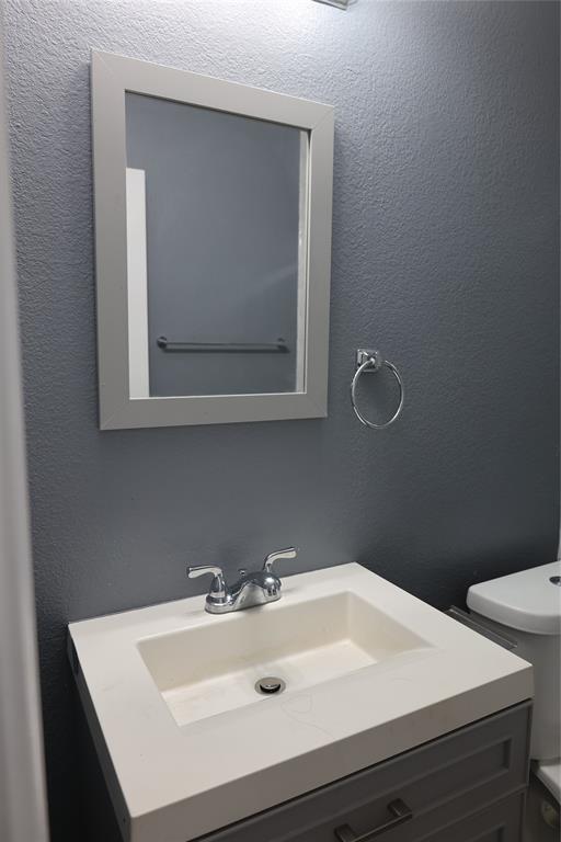 1714 Elm Street Anna, TX 75409 - Photo 24 of 27 a bathroom with a sink and a toilet