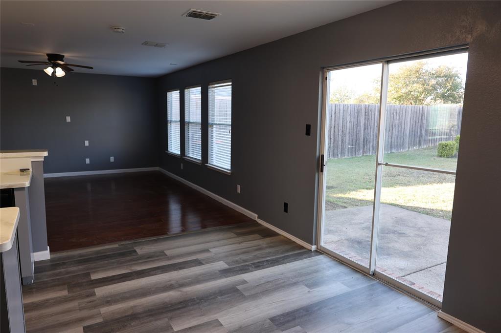 1714 Elm Street Anna, TX 75409 - Photo 7 of 27 a view of an empty room with glass door