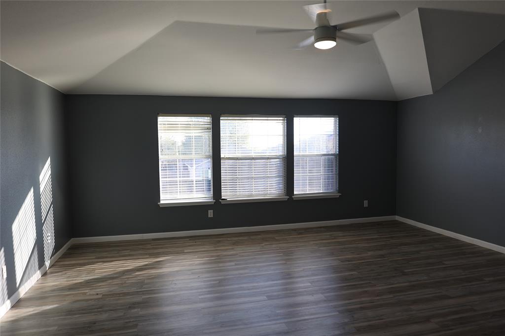 1714 Elm Street Anna, TX 75409 - Photo 10 of 27 wooden floor in an empty room with a window