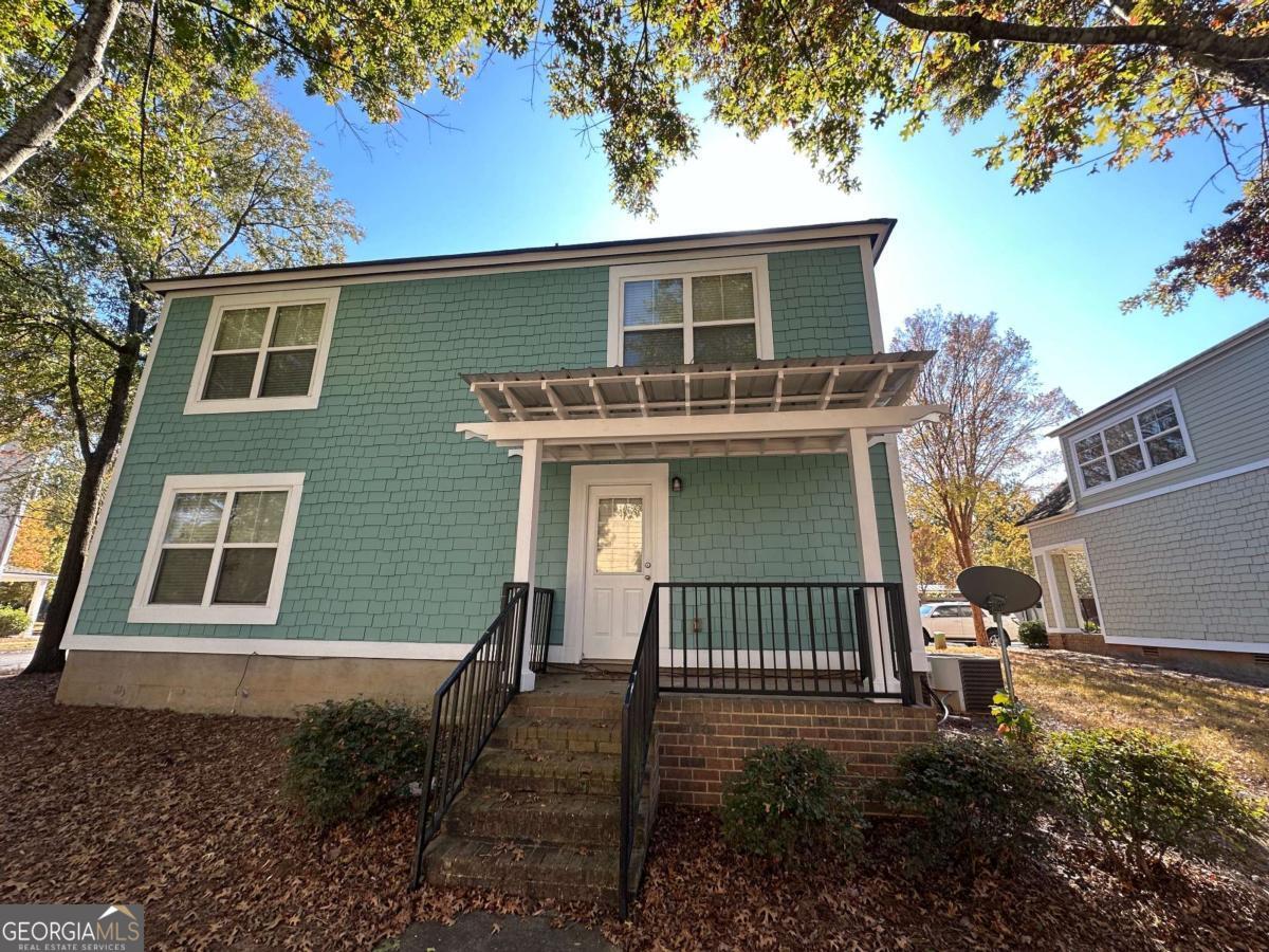 1035 South Barnett Shoals Road, Unit 461 Athens, GA 30605 - Photo 4 of 4 a view of a house with a yard