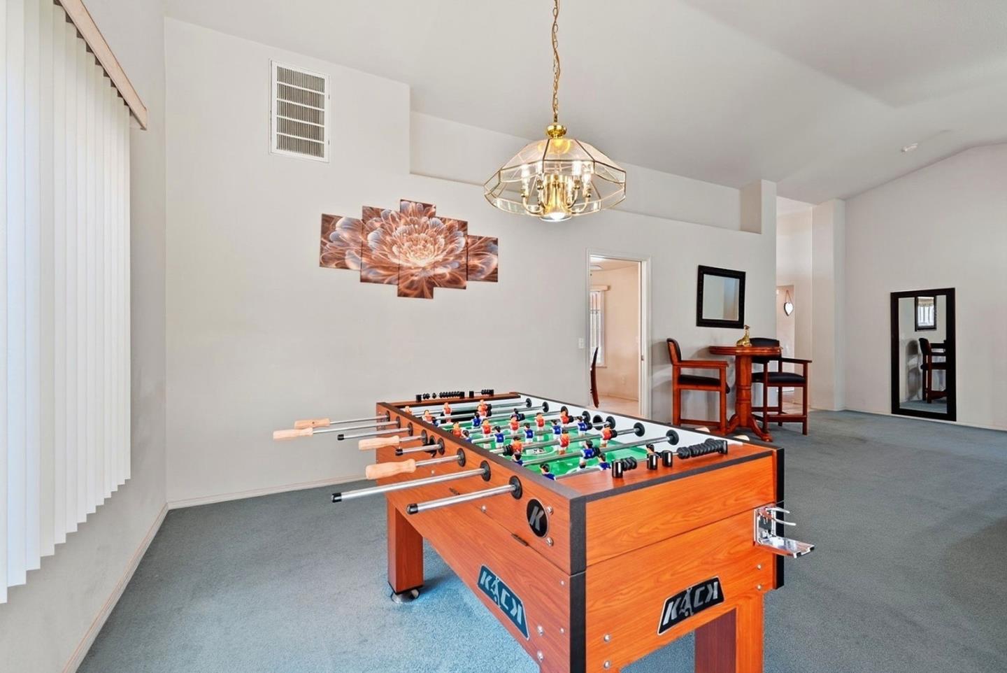 3882 Pintail Court Merced, CA 95340 - Photo 14 of 21 a view of a dining room with furniture and chandelier