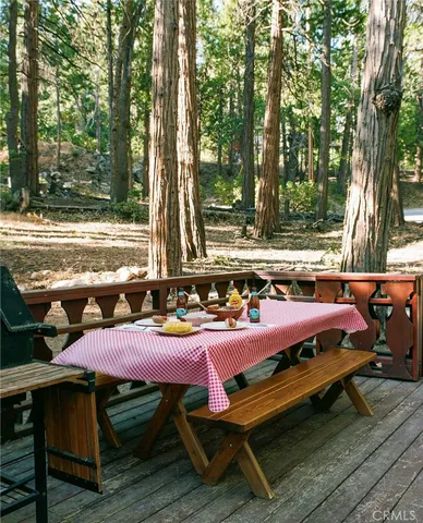 a view of house with outdoor space and sitting area